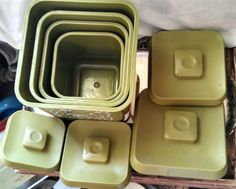 several green square dishes stacked on top of each other