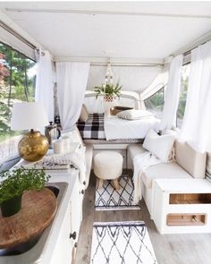 the interior of a camper is clean and ready to be used as a bed