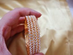 🌟 Welcome to The Divine Fashion on Etsy! 🌟 Step into a realm of elegance and grace with our captivating Partywear Gold-Plated Hammered Style Bangle Set - an enchanting piece of Indian jewelry that embodies the essence of weddings and all special occasions. Indulge in the radiance of these meticulously handcrafted bangles, designed to adorn the wrists of brides, bridesmaids, and every woman who desires a touch of sophistication. The intricate hammered style exudes a unique charm, making them a truly exceptional addition to your jewelry collection. stunning bangles, meticulously crafted with love and attention to detail. The lustrous gold plating adds a timeless allure, allowing you to make a memorable statement at any celebration. These exquisite bangles are not only an expression of Indi Gold Sparkling Bracelets For Wedding, Sparkling Gold Bracelets For Wedding, Stackable Bangle Jewelry For Wedding, Stackable Wedding Bangle Jewelry, Sparkling Bangle Bracelets For Wedding, Dazzling White Bangle For Wedding, Bridal Bangle Set, Indian Bangles, Gold Plated Bangles