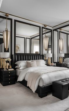 a bedroom with mirrored walls and black furniture