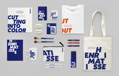 an assortment of stationery items including a tote bag, t - shirt, pencils and pens