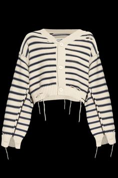 a white and blue striped sweater with laces on the sleeves, in front of a black background