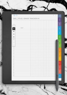 a tablet with a notepad and pen sitting on it next to a marble background