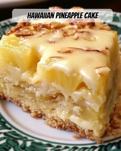 a piece of cake on a plate with the words hawaiian pineapple cake above it