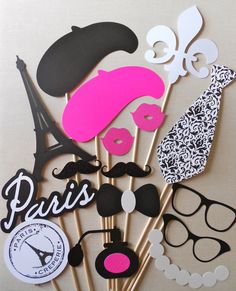 the cake toppers are decorated with pink and black mustaches, lips, and glasses