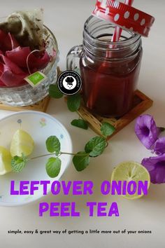 there is a jar of tea next to some sliced lemons and purple flowers with the words leftover onion peel tea