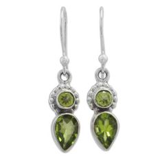 Over three carats of teardrop and circular peridot stones with beautiful green hues adorn this pair of Indian dangle earrings handcrafted from sterling silver by local artisans. Shanker proudly presents his own designs in these wonderful earrings. Earrings Handmade Silver, Rough Gemstone Ring, Handmade Silver Earrings, Raw Opal Ring, Peridot Jewelry, Peridot Earrings, Turquoise Earrings Dangle, Birthstone Earrings, Silver Earrings Handmade