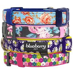 four floral dog collars stacked on top of each other