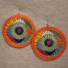 Zulu Beaded Earrings Made from colorful seed beads Earrings are very lightweight  Size: 3.5in width  earring hook post with rubber earring backs provided Multicolor Beaded Earrings With Ear Wire For Summer, Colorful Large Beaded Earrings, Multicolor Beaded Earrings For Summer, Summer Multicolor Beaded Earrings With Round Beads, Summer Multicolor Beaded Round Earrings, Multicolor Large Beaded Round Earrings, Colorful Beaded Round Earrings For Beach, Colorful Round Beaded Earrings For Beach, Multicolor Dangling Beads Earrings For Beach