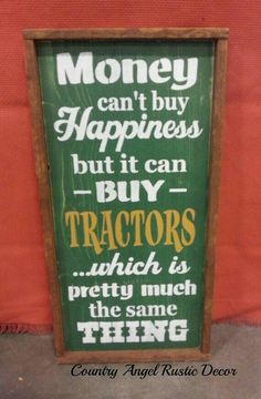 a sign that says money can't buy happiness but it can buy tractors which is pretty much the same thing