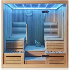 the inside of a sauna is lit up with blue lights and wooden slats