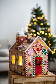 a gingerbread house is decorated with candy canes