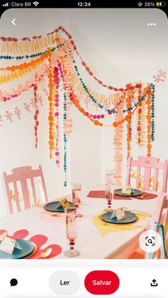 the table is set with plates and place settings