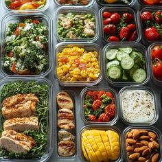 a tray filled with lots of different types of food next to sliced fruit and vegetables