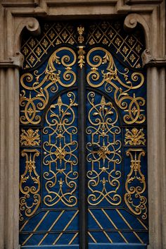 an ornate blue and gold door is shown