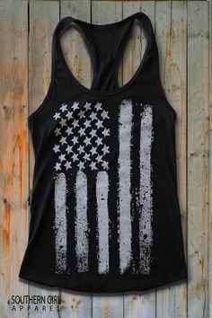 "White American Flag on black racerback Tank Top -These tanks are soft and comfortable, perfect for the music festivals, 4th of July or anytime... -60% Combed Ring-Spun Cotton 40% Polyester -30 single for extreme softness -Pre-shrunk for reduced shrinkage -Finished edge Measurements are taken lying flat across seam to seam 1\" below arm hole for chest Available in Small thru XL SMALL: Length- 28\" - Chest Width- 16\" across seam to seam MEDIUM: Length- 28 1/2\" - Chest Width- 17\" across seam to Casual Black Tops For Music Festivals, Casual Black Top For Music Festivals, Black Summer Top With American Flag Print, Black Tops With American Flag Print For Summer, Cotton Screen Print Racerback Tank Top, Black Racerback Tank Top With Letter Print, Black Flag Print Top For Streetwear, Casual Black Top With Flag Print, Black Flag Print Top For Summer