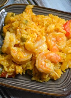 a plate with rice and shrimp on it