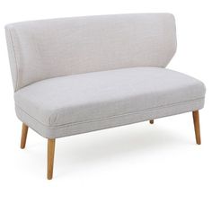 a white couch sitting on top of a wooden frame