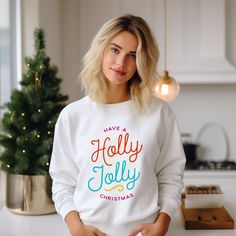 Custom printed holiday t-shirt design features colorful modern typography in bright colors. The text reads "Have a Holly Jolly Christmas". Holiday Typography, Have A Holly Jolly Christmas, Holly Jolly Christmas, Modern Script Font, Jolly Christmas, Modern Typography, Classic Holiday, Christmas Holly, Seasonal Gifts