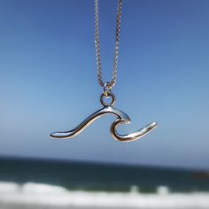 This wave pendant is made of solid 925 sterling silver which makes this necklace to be water resistant. Pendants size is - 10mm high and 30mm wide Each pendant hangs on your choice of 925 sterling silver chain in the length of your choosing. Make your selection at checkout. (Please see care tips below) Length Options: 16 inches 18 inches 20 inches These eye-catching necklace is perfect on it's own or look great layered with other pieces for the perfect Boho look! Can be the best gift for you or Surfer Girl Gifts, Silver Surf, Surf Necklace, Wave Pendant, Wave Jewelry, Surf Jewelry, Wave Necklace, Mermaid Jewelry, Long Silver Necklace