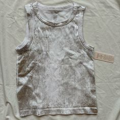 New With Tags White And Silver Metallic Tank Top Size: Medium Brand: No Comment Bought From Macy’s Description Foil Print Scoop Neck Tank Top Colors: Foil, White, Silver, Grey, Metallic, Gunmetal Very Stretchy Fabric Ribbed Tank Top Slightly Cropped High Neck White Tank Top With Silver Foil Overlay Cool Distressed Silver Metallic Detailing Shiny, Glittery, Beaded Cami Sequin Reflection Brand New With Tags, Nwt Really Trendy Style Right Now! Perfect Paired With A Pair Of Denim Jeans, To Go To The Friends Makeup, Frilly Top, Low Cut Top, Black Camisole, Scoop Neck Tank Top, Tanktop Girl, Dinner With Friends, Ribbed Tank Top, Grey Tank Top