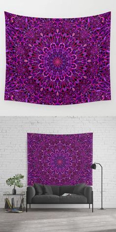 a purple wall tapestry hanging on the side of a white brick wall next to a couch