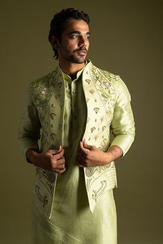 Pistachio green bamberg silk nehru jacket with multi-colored thread embroidered egyptian scripture inspired motifs. - Aza Fashions Spring Embroidered Nehru Jacket With Stand Collar, Green Outerwear With Zari Work For Festivals, Traditional Green Outerwear With Stand Collar, Traditional Green Stand Collar Outerwear, Traditional Fitted Nehru Jacket For Spring, Festive Designer Green Outerwear, Fitted Green Outerwear With Resham Embroidery, Green Long Sleeve Nehru Jacket For Spring, Green Long Sleeve Sherwani For Spring