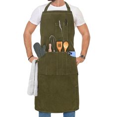 a man is wearing an apron with utensils in it and holding his hands on his hip