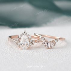 two wedding rings with diamonds on them