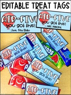 some candy bars are sitting on a table with the words air - five give you got this