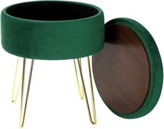 a green stool with gold legs and a wooden table in the middle that has a round top on it