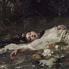 a painting of a woman laying on the ground in water with lily pads around her