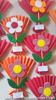 paper flowers are arranged on top of each other