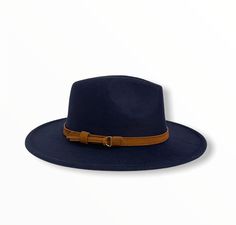 CLARKE - NAVY BLUE A new spin on our best-selling hat, the Clarke fedora embodies a balance between modern and vintage with its simplistic design, which is offset by a hand-stitched leather headband. Available in size Medium 54-58cm and Large 58-62cm. Features an adjustable inner strap to ensure your hat is the proper fit. Removable headband FREE shipping on every order Leather Headband, Leather Headbands, Wide Brim Fedora, Simplistic Design, Stitching Leather, Wide Brimmed, Hand Stitched, Fedora, Navy Blue