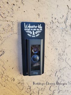 a sign on the wall that says welcome to us and has an image of a speaker