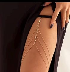 Add a touch of elegance to your outfit with this beautiful thigh chain. Designed to be worn with high-slit dresses or skirts, this delicate chain jewelry drapes across your thigh, enhancing your leg's natural shape. The adjustable elastic strap ensures a comfortable and secure fit, making it perfect for any occasion, whether casual or formal. Made from lightweight gold-tone metal, this thigh chain adds a hint of glamor and sophistication to your look. Ideal for pairing with evening wear or festival outfits, it's the ultimate accessory for a bold, chic statement. Leg Body Jewelry, Body Jewelry Nude, Thigh Garter Jewelry, Thigh Chain Jewelry, Egyptian Pantheon, Chain Garter, Thigh Jewelry, Thigh Band, Matric Farewell