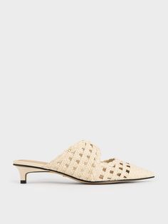 Ease into the summer mood with these mules. The woven raffia texture and keyhole cut-outs introduce a distinctive aesthetic to the crisp pointed-toed profile, giving it a relaxed-chic feel. In white, they will brighten up your ensembles and remain a timeless style year-round. With the added bonus of kitten heels, they will add lift to your frame for an effortlessly flattering silhouette. Summer Mood, Woven Raffia, Charles Keith, Kids Gifts, Trending Accessories, Timeless Fashion, Kitten Heels, Heel Height, Shoes Heels