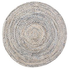 a round rug made out of various colors and sizes on a white background with an oval pattern