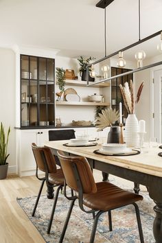 a dining room table with chairs around it