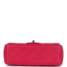 This Mini Top Handle Rectangular flap bag is in fuschia lambskin with light gold tone hardware and has a front flap with signature CC turnlock closure, rear half moon pocket, dark and fuschia top handle and single interwoven fuschia leather and light gold tone chain link shoulder/crossbody strap.The interior is lined in fuschia leather and features a zipper pocket with Chanel pull and an open pocket below.Collection: 2021 (RFID)Origin: FranceCondition: Pre-owned; Mint - This bag retains its shape. The exterior leather is clean with no signs of wear except a few small press marks to back exterior pocket from chain strap. There's no plastic on the hardware but no signs of scratching. The interior leather is clean with no signs of wear.Accompanied by: Chanel box, Chanel dustbag, RFID chip Mea Designer Rectangular Flap Bag With Cc Turnlock Closure, Pink Leather Shoulder Bag With Cc Turnlock Closure, Pink Flap Bag For Formal Occasions, Pink Formal Flap Bag, Pink Leather Bag With Cc Turnlock Closure, Pink Leather Double Flap Bag, Designer Pink Double Flap Shoulder Bag, Pink Designer Double Flap Shoulder Bag, Luxury Pink Rectangular Flap Bag