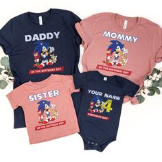 three personalized onesuits with sonic the hedgehog on them, one for each child