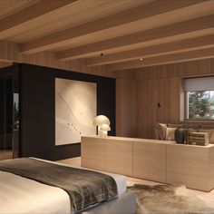 a bedroom with a large bed and wooden walls