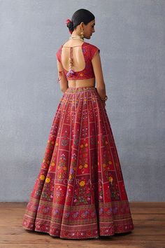 Red flared attached cancan lehenga crafted in organza with all over Gul Mahal digital print and tassel ornamentation detail. Paired with a short sleeves Queen Anne's neckline choli cut floral print blouse with gota trim lace embellishments and a matching dupatta with multi thread tassels detailing. - Aza Fashions Red Floor-length Choli For Transitional Season, Designer Wear Red Choli With Motifs, Red Choli With Motifs For Navratri, Red Lehenga With Motifs For Navratri, Red Choli With Motifs For Transitional Season, Red Sharara With Unstitched Blouse For Transitional Season, Transitional Red Sharara With Unstitched Blouse, Transitional Red Sharara With Blouse, Red Fitted Sharara For Transitional Seasons