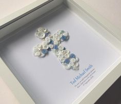 a white frame with buttons in the shape of a cross