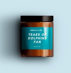 a jar of teas of dolphins fan on a blue background