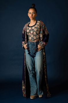 Blue silk long jacket, highlighted with floral and zardozi hand embroidery. Paired with an inner top with all over floral hand embroidery and fringed tassels.
Components: 2
Pattern: Hand Embroidery
Type Of Work: Floral, Zardozi
Neckline: Top: Round Neck
Sleeve Type: Jacket: Full Sleeves
Fabric: Silk
Color: Blue
Other Details: 
Note: Pant worn by the model is not for sale
Occasion: Sangeet,Party - Aza Fashions Round Neck Jacket, Floral Hand Embroidery, Long Jacket, Top Round, Fabric Silk, Blue Silk, Full Sleeves, Women Tops, Aza Fashion