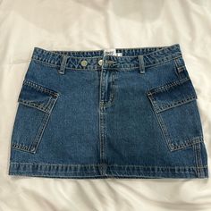 Nwot Princess Polly Denim Mini Skirt. It Has Cargo Style Pockets On The Sides Of The Skirt. Basically New, It Just Doesn’t Fit Me Anymore. Denim Mini Skirt With Side Pockets, Denim Blue Cotton Mini Skirt With Pockets, Medium Wash Denim Mini Skirt With Pockets, Y2k Cutoff Denim Skirt With Pockets, Y2k Denim Skort With Pockets, Denim Skirt Mini, Button-up Denim Mini Skirt With Pockets, Non-stretch Denim Mini Skirt With Pockets, Denim Skort