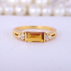 Baguette Cut Citrine Engagement Ring, Cluster Diamond Statement Ring, 10K Solid Gold Women Jewelry, Art Deco Ring, Personalised Gift For Her Description: Main Stone - Citrine ( Lab Created ) Stone Size - 8 x 4 MM Stone color - Yellow Stone shape - Baguette Stone Birth Month: November Second Stone: CZ Diamond Stone Shape: Round Stone Color: Colorless Stone cut - Brilliant Cut Finishing- Excellent feel free to contact me if you have any questions  Gemstone color may slightly vary from listed image November Birth Stone Rings, Gold Baguette-cut Topaz Ring For Wedding, Gold Baguette Cut Topaz Wedding Ring, Gold Baguette Cut Topaz Ring For Wedding, Gold Citrine Baguette Cut Ring, Gold Topaz Birthstone Ring Gift, Gold Baguette Cut Birthstone Ring For Formal Occasions, Gold Baguette Cut Topaz Ring Fine Jewelry, Gold Birthstone Ring With Rectangular Stone For Anniversary