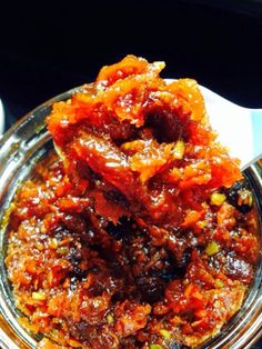 a bowl filled with food sitting on top of a table