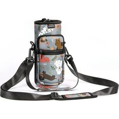 an image of a bag that has animals on it and is being held by a lanyard strap